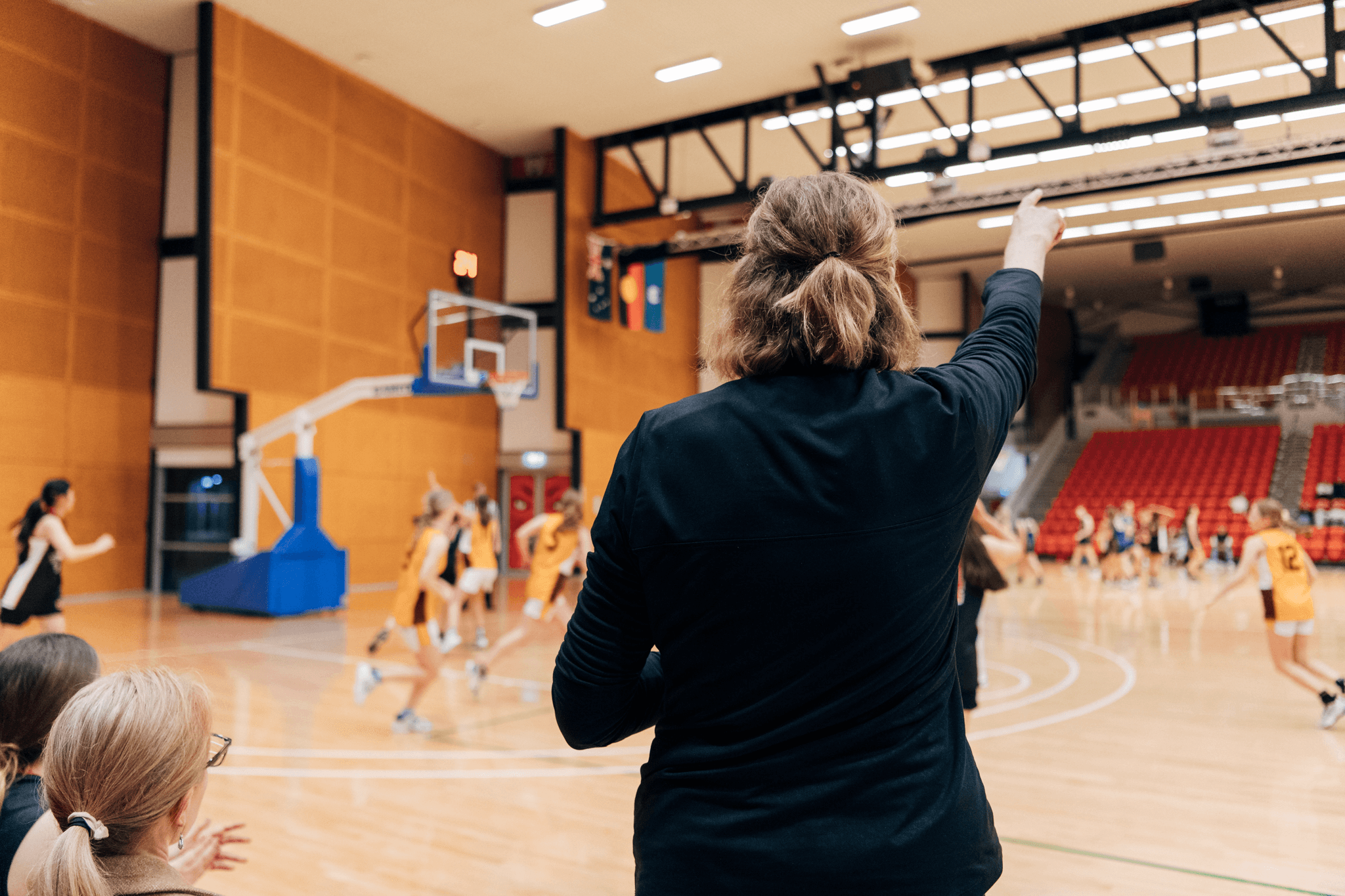 Lady coaching basketball game